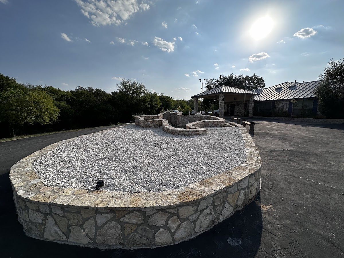 Large stone retaining wall landscape feature
